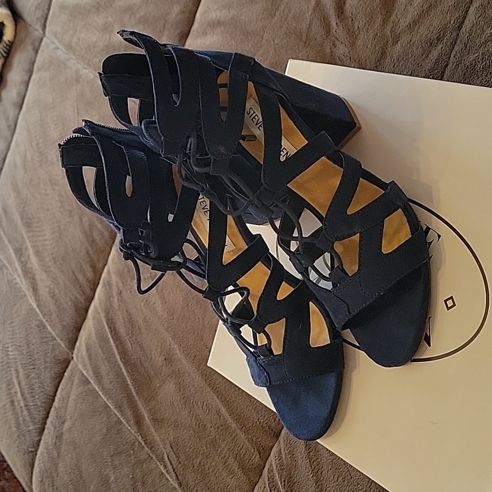 Navy blue suede-like lace up heels.